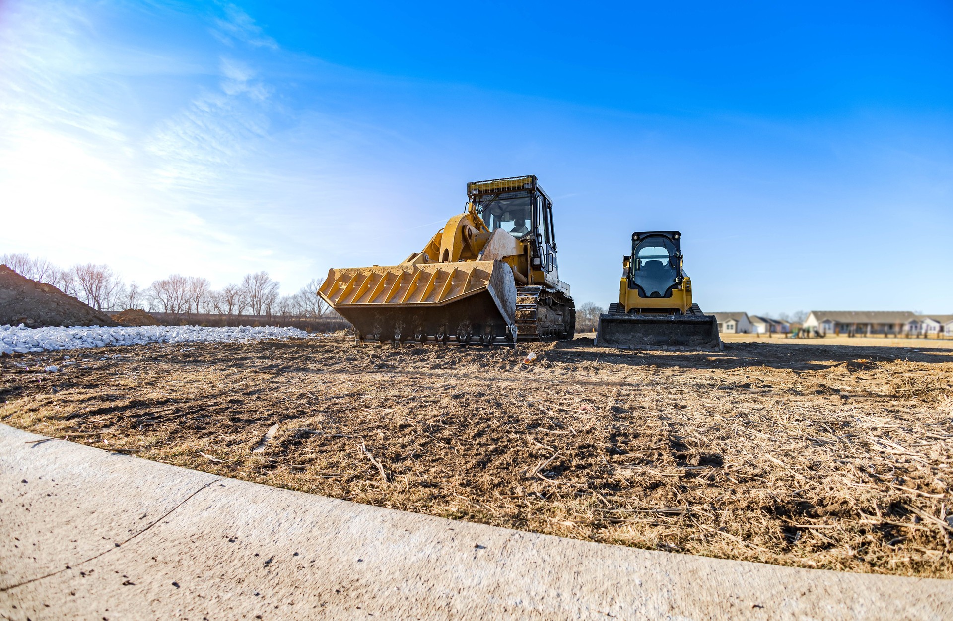Track bulldozer at the construction site with the blue sky.