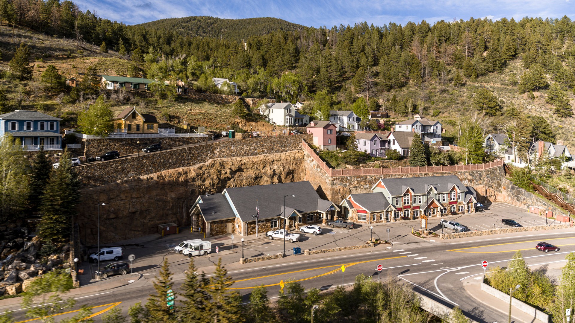Small town buildings along mountain highway. Residential homes built on hillside in Black Hawk, Colorado.